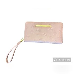 Betsy Johnson Wristlet with lips all over it.